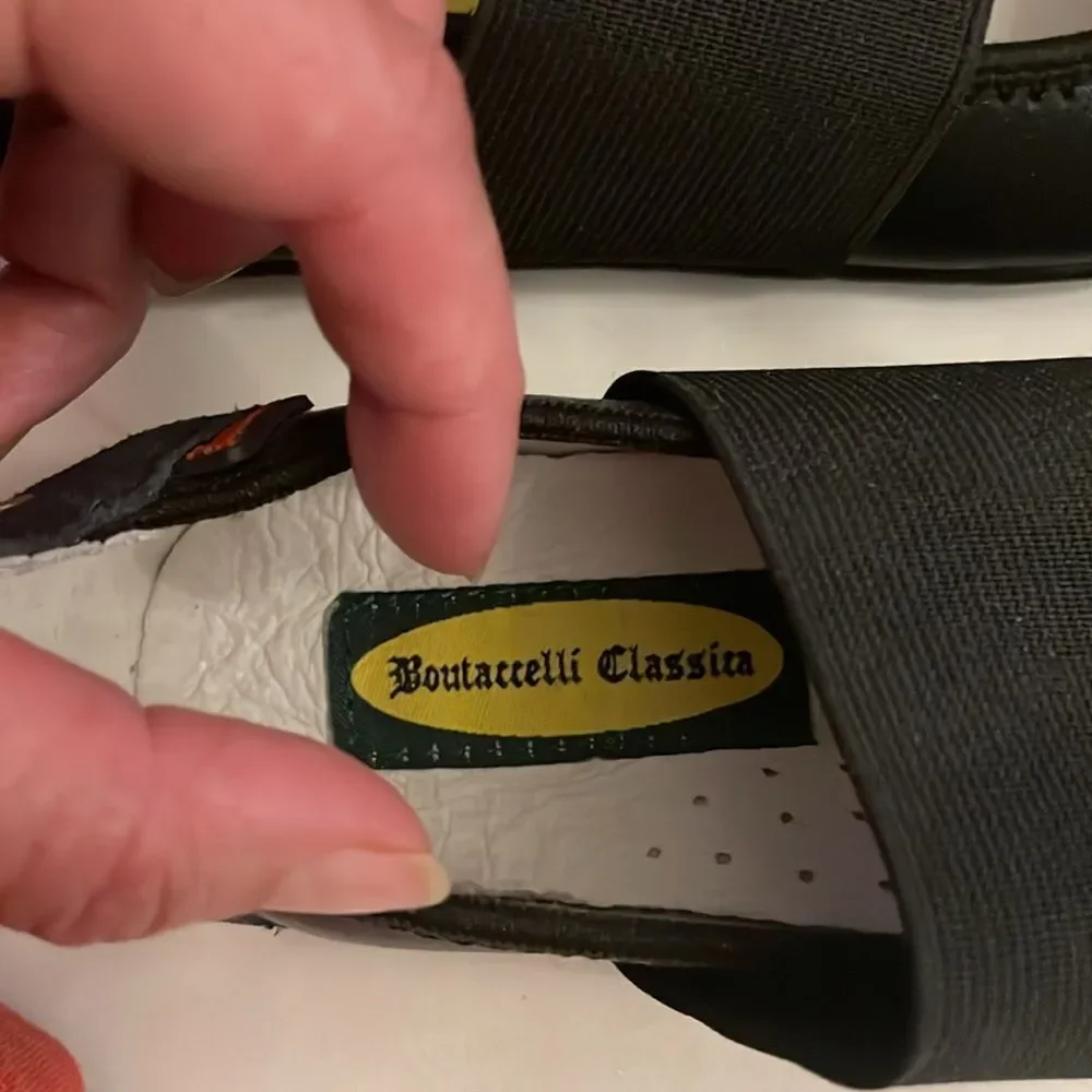 BOUTACCELLI CLASSICS black zippered front, stud design w/studs also on back heel